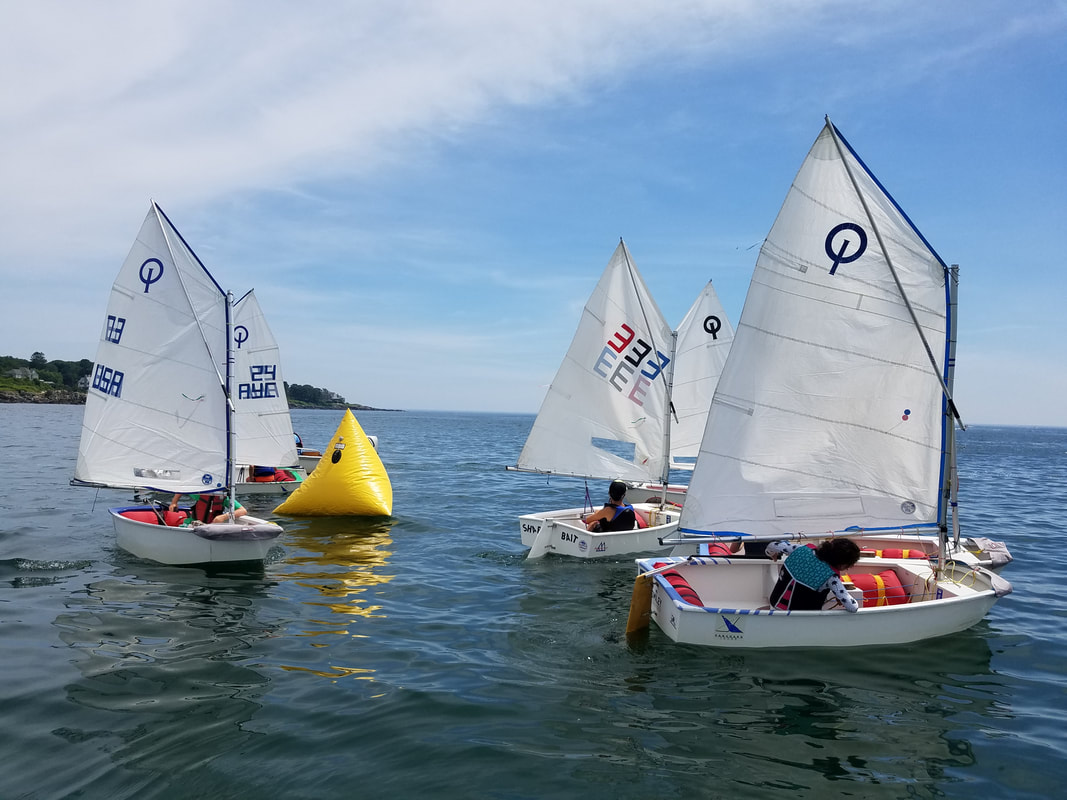 Young sailors practicing in Optimist dinghies